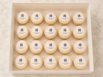 Corporate macarons with edible icing print of company logo