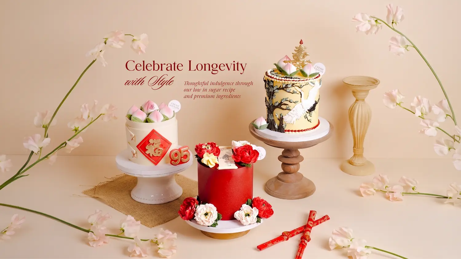 Assorted wedding-style cakes on stands with pink floral decorations against a soft beige background.